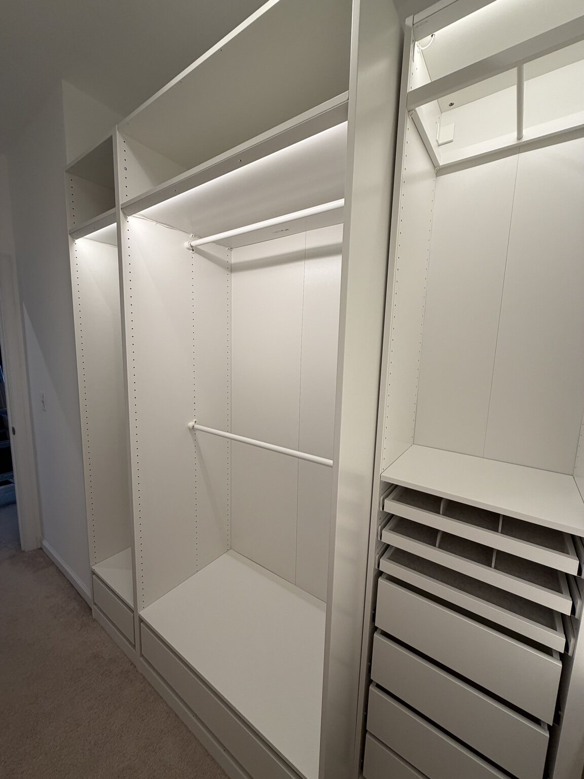 Walk-in closet shelving, hanging rods and drawers